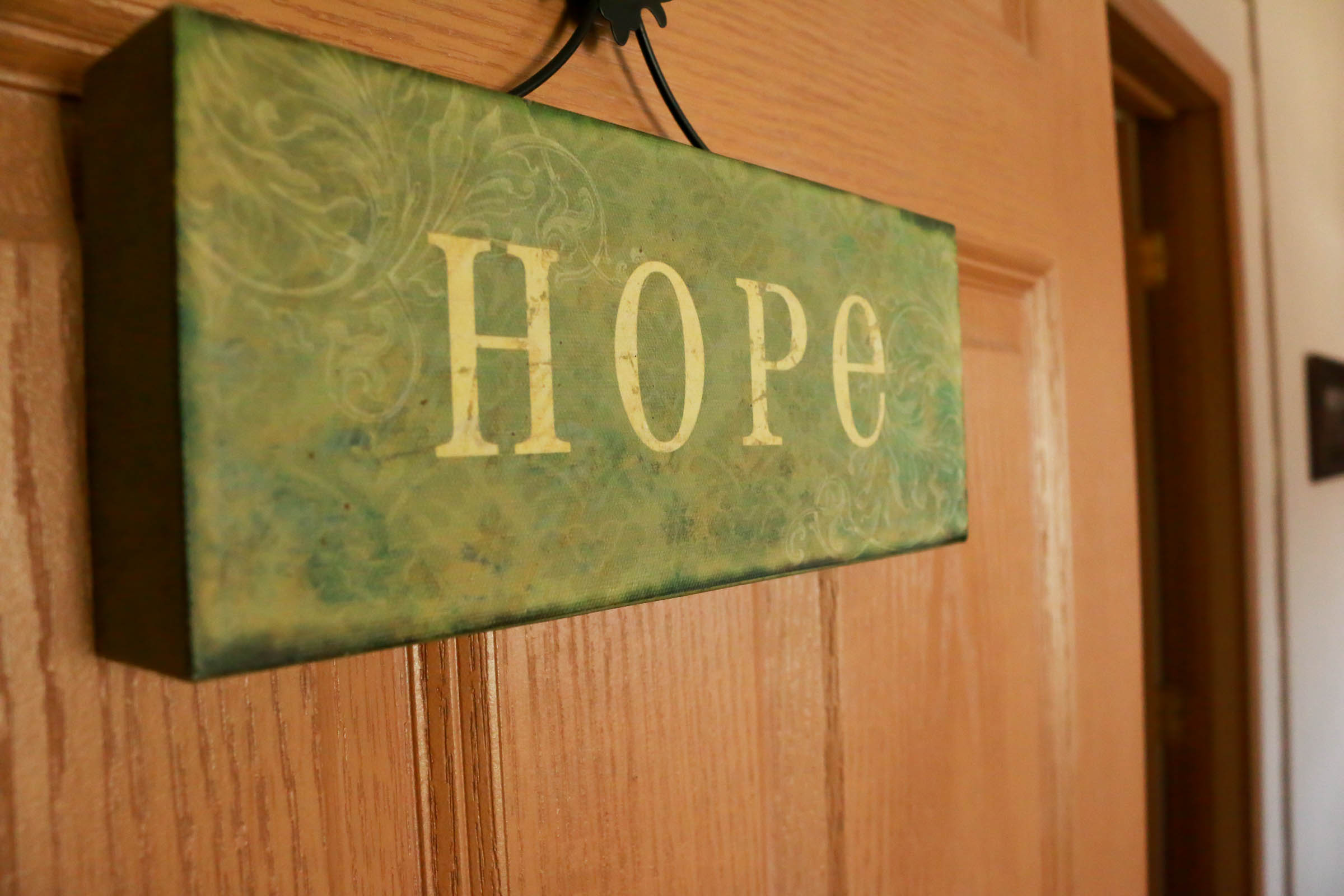 "Hope" sign hung on an office door in Waterloo location.